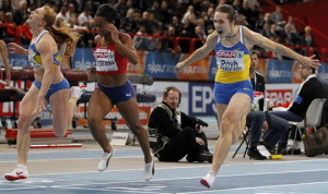 Ukraine's Oleya Povh (R) runs to win the women's 60m final along with Norway's Ezinne Okparaebo (C) and Ukraine's Hrystyna Stuy (L) at the European Athletics indoor championships in Paris March 6, 2011. REUTERS/Charles Platiau (FRANCE - Tags: SPORT ATHLETICS)